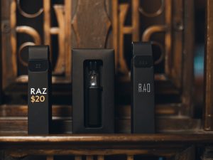 Upfront Cost: Disposable vs. Starter Kit A price tag on a Raz disposable vape compared to a price tag on a boxed vape starter kit