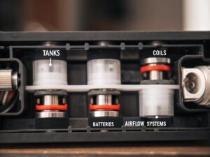 Engineering schematic of a compliant vape A detailed schematic or CAD drawing of a complex multi-tank vape device.